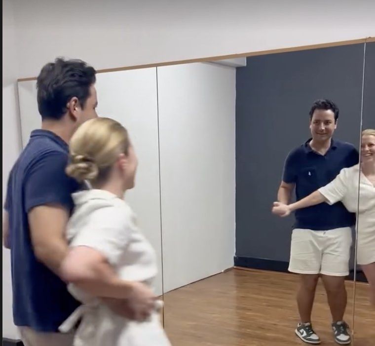 A couple practising their first dance in the studio