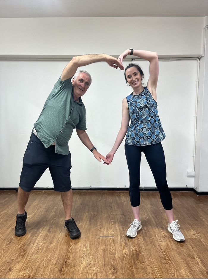 A father and daughter in a wedding-dance lesson